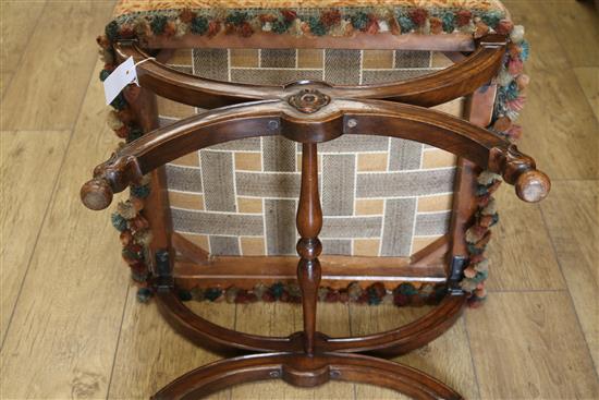 A Victorian rosewood X shaped stool, with old tapestry upholstered top, W.52cm